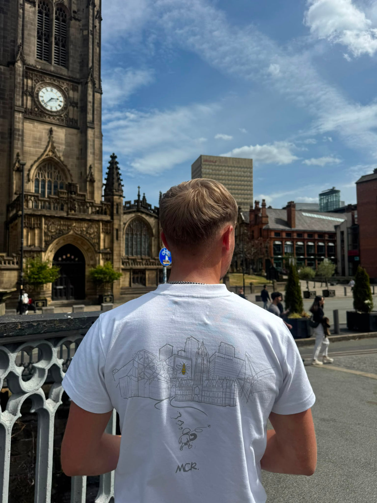 Model viewed from behind wearing our 'City United' T-shirt in a medium from the collection. 

Model is 5'10 medium build.